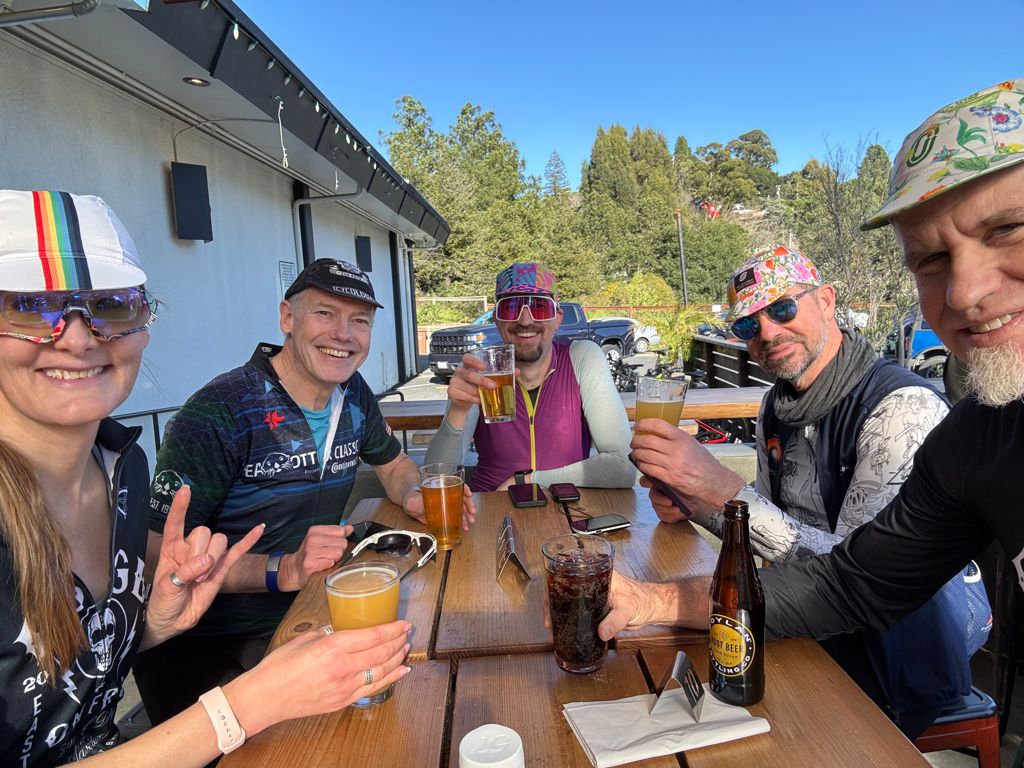 cyclists enjoying beers together