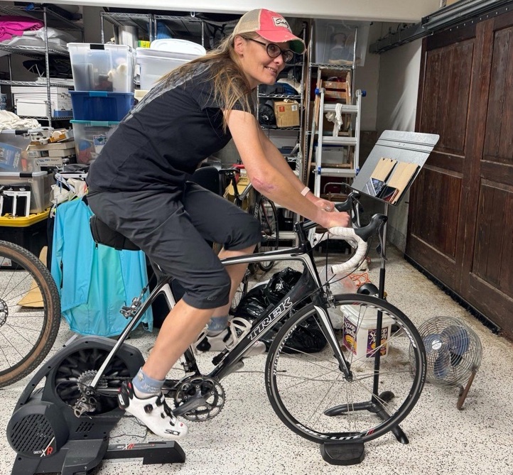 tracey on stationery bike doing a ZWIFT workout