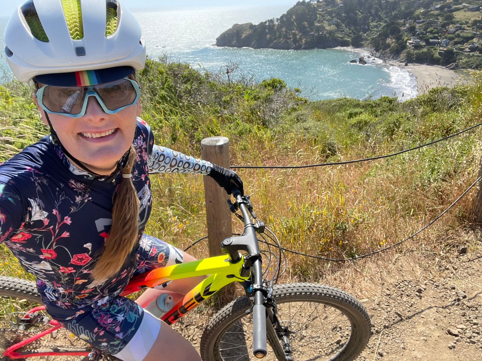 tracey with bike in front of muir beach