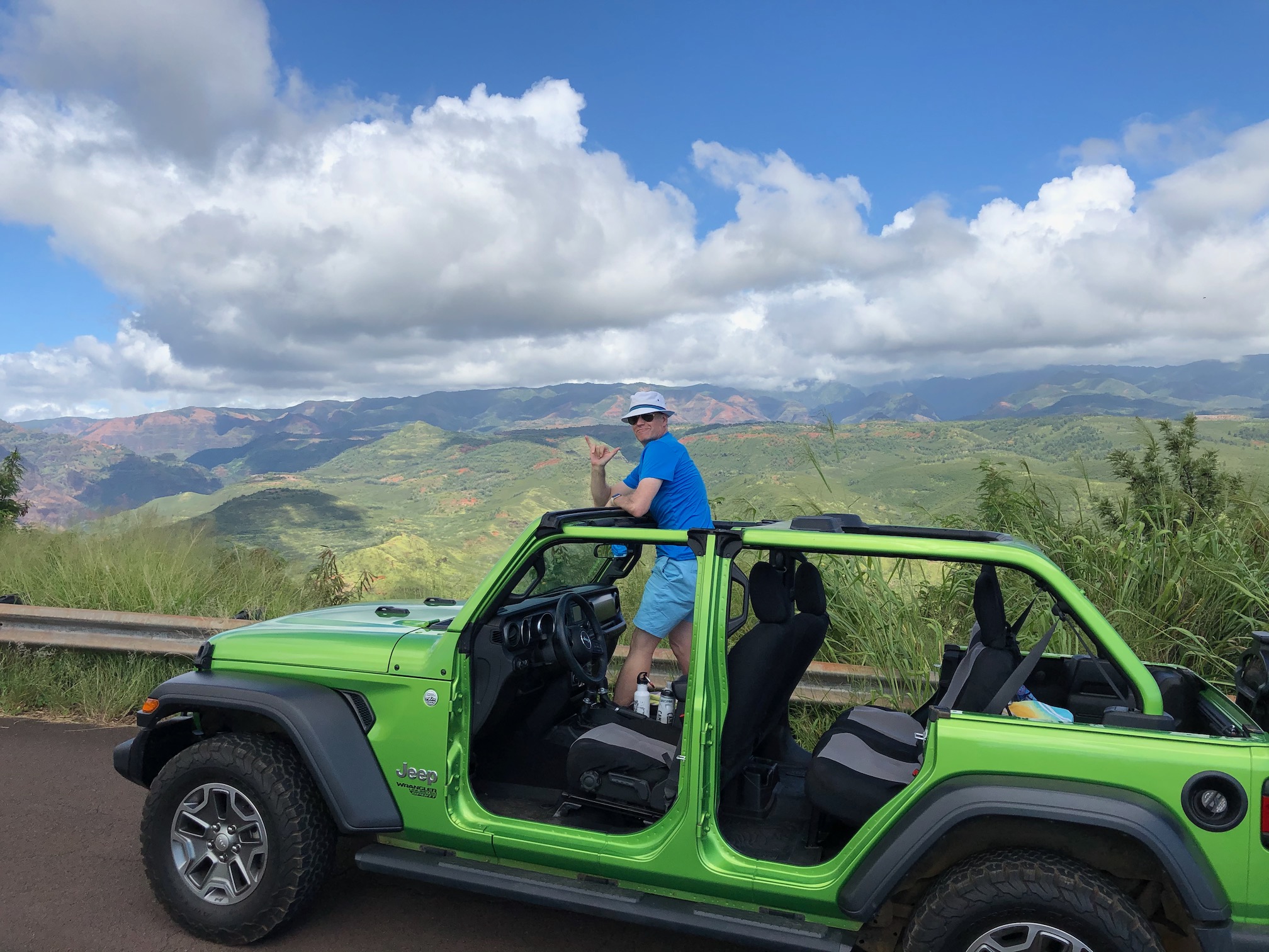 hunter standing in jeep