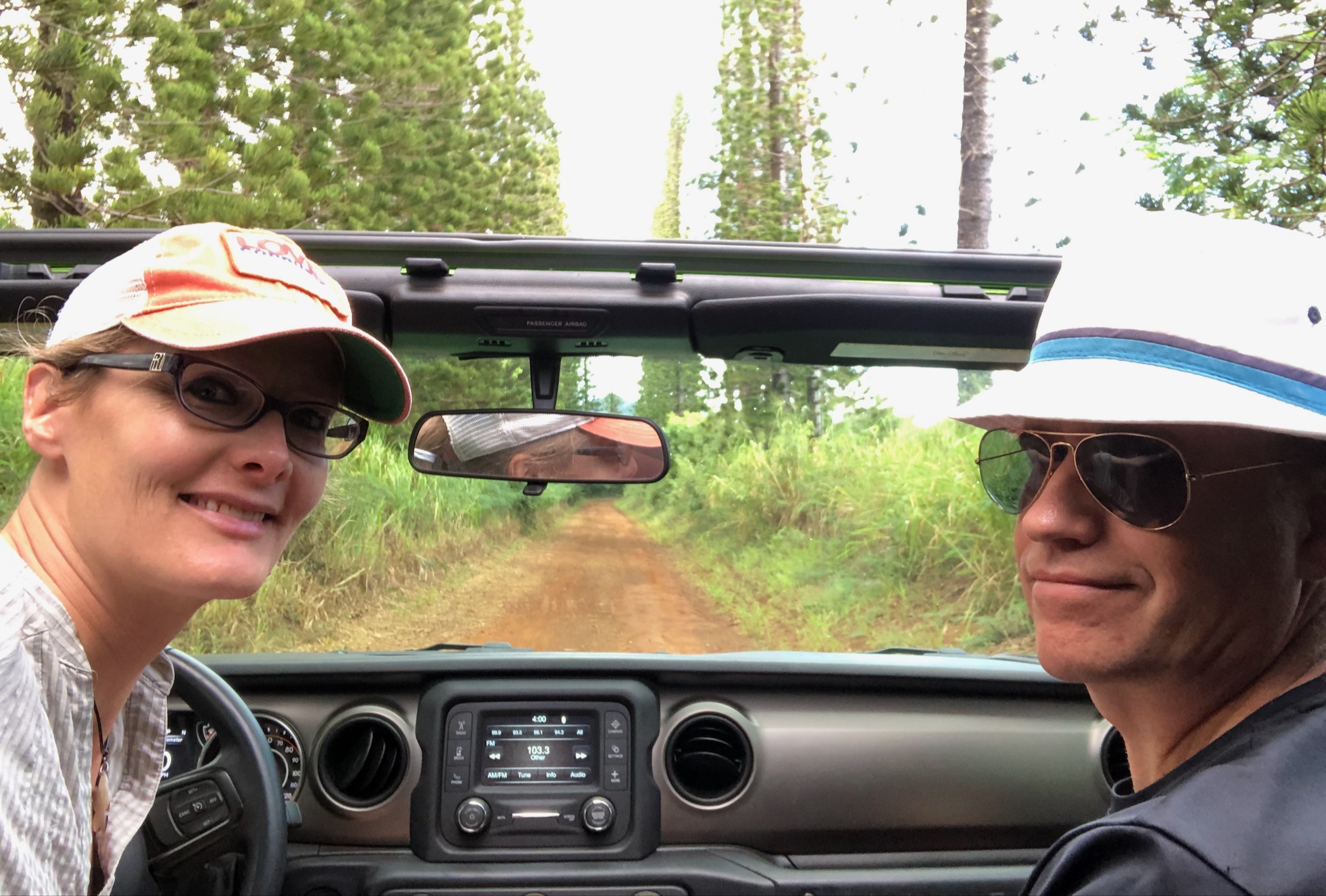 tracey & hunter in jeep on dirt road