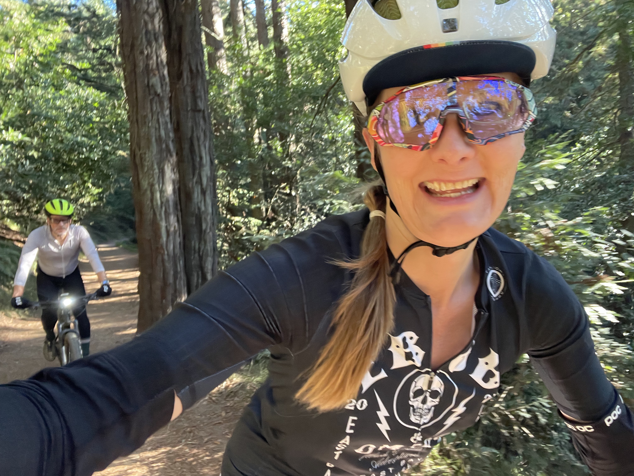 tracey & hunter biking through redwoods