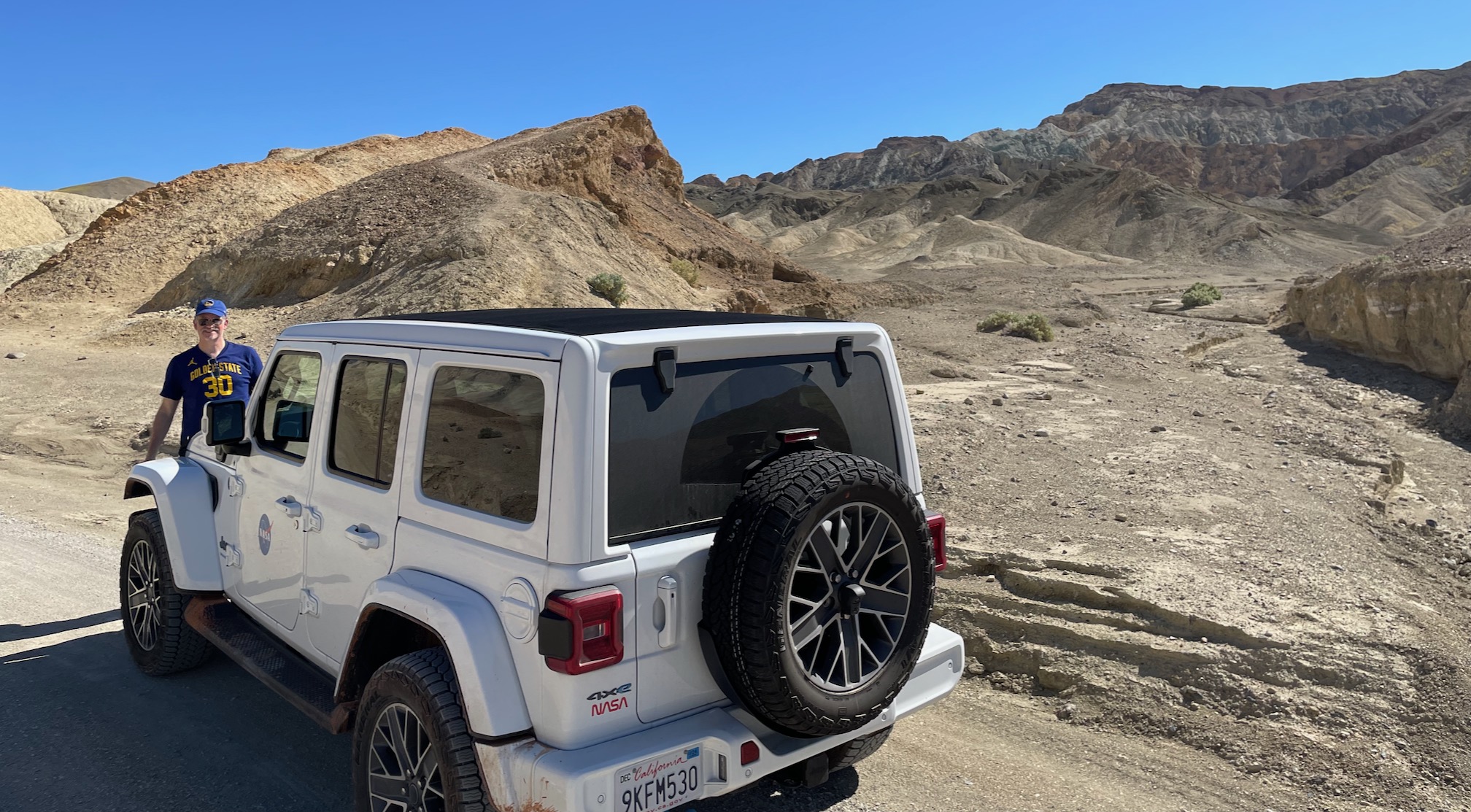 hunter by jeep in desert canyon