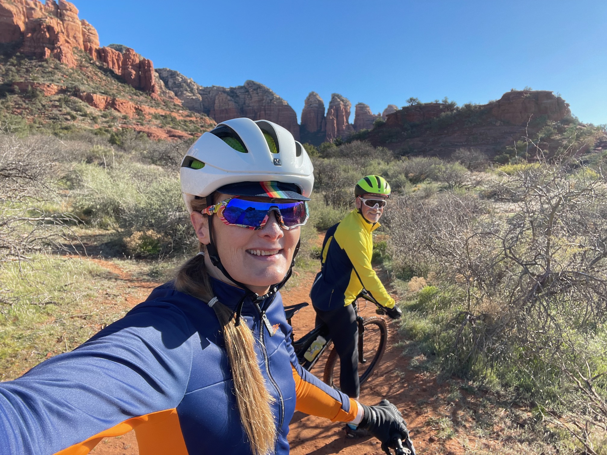 tracey & hunter biking in sedona desert
